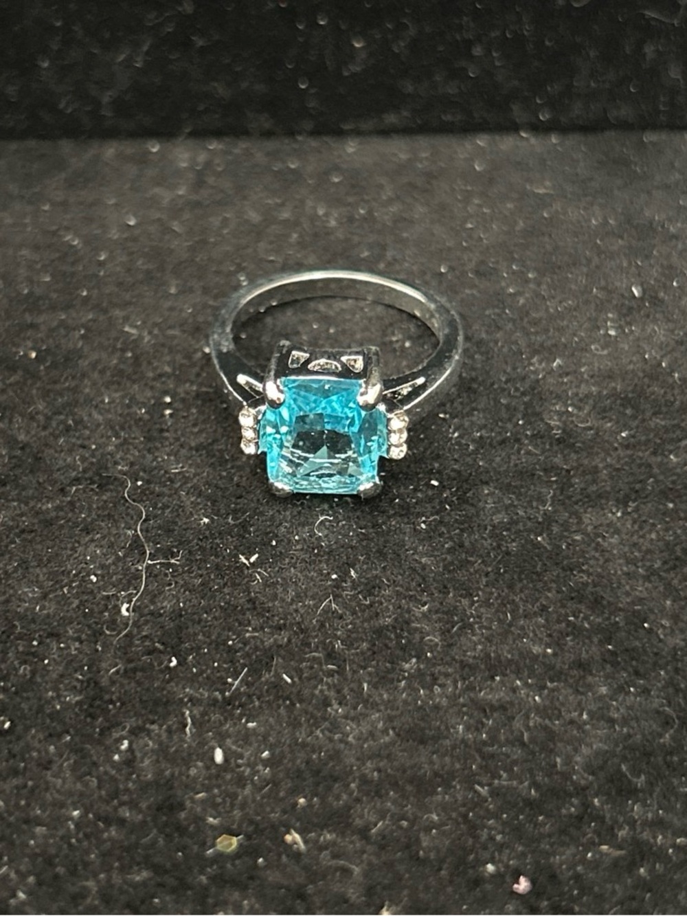 Elegant Silver color Ring with Aqua Blue Cushion-Cut Stone